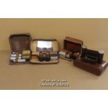 *Four leather cased male grooming sets.