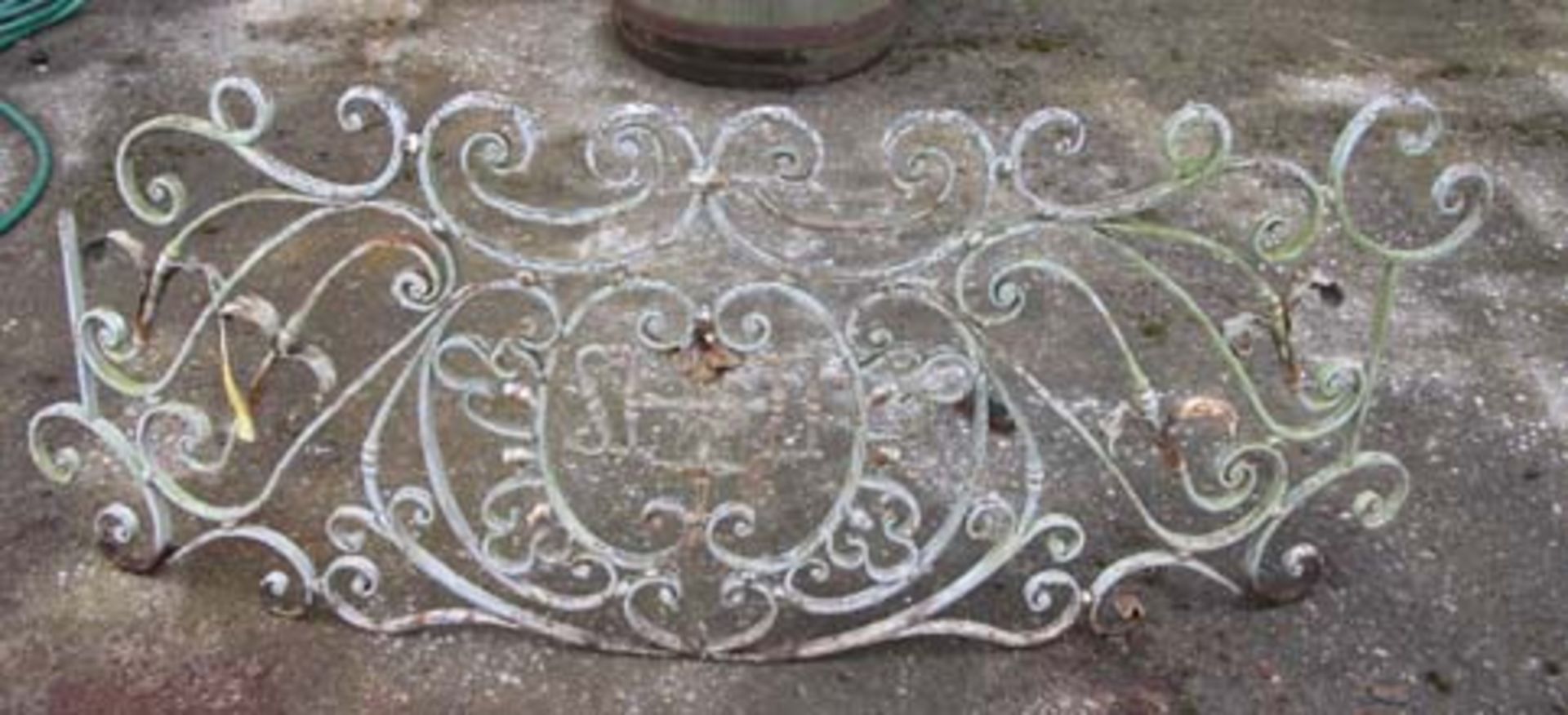*FRENCH DECORATIVE WROUGHT IRON BOWED BALCONY FRONT, EARLY 1900S. 665MM (26IN) HIGH X 1650MM (