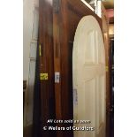 *THREE PITCH PINE PANEL DOORS AND A MODERN ARCHED TOP DOOR