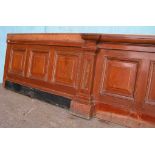 *3M RUN OF ANTIQUE RECLAIMED MAHOGANY PUB BAR FRONT. 960MM (37.75IN) HIGH X 3125MM (123IN) WIDE X