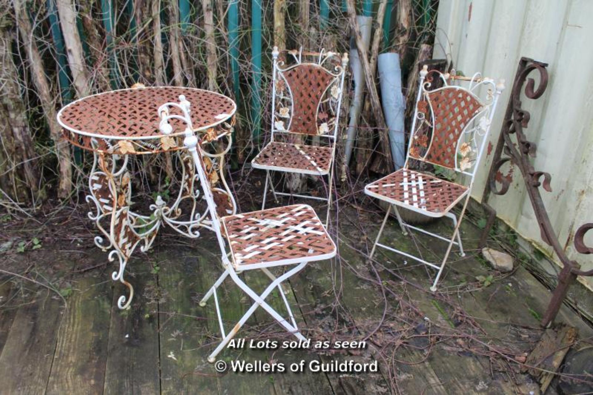 *DECORATIVE METAL GARDEN TABLE AND FOUR CHAIRS