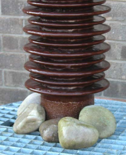 *CERAMIC ELECTRICITY INSULATOR, SET UP AS A WATER FEATURE, LATE 1900S. HEIGHT 1240MM (48IN) X - Image 6 of 6
