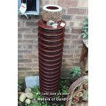 *CERAMIC ELECTRICITY INSULATOR, SET UP AS A WATER FEATURE. LATE 1900S