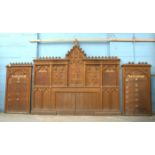 *HIGHLY CARVED OAK REREDOS WITH COMMANDMENT BOARDS, CIRCA 1900. TOTAL SIZE INCLUDING COMMANDMENT