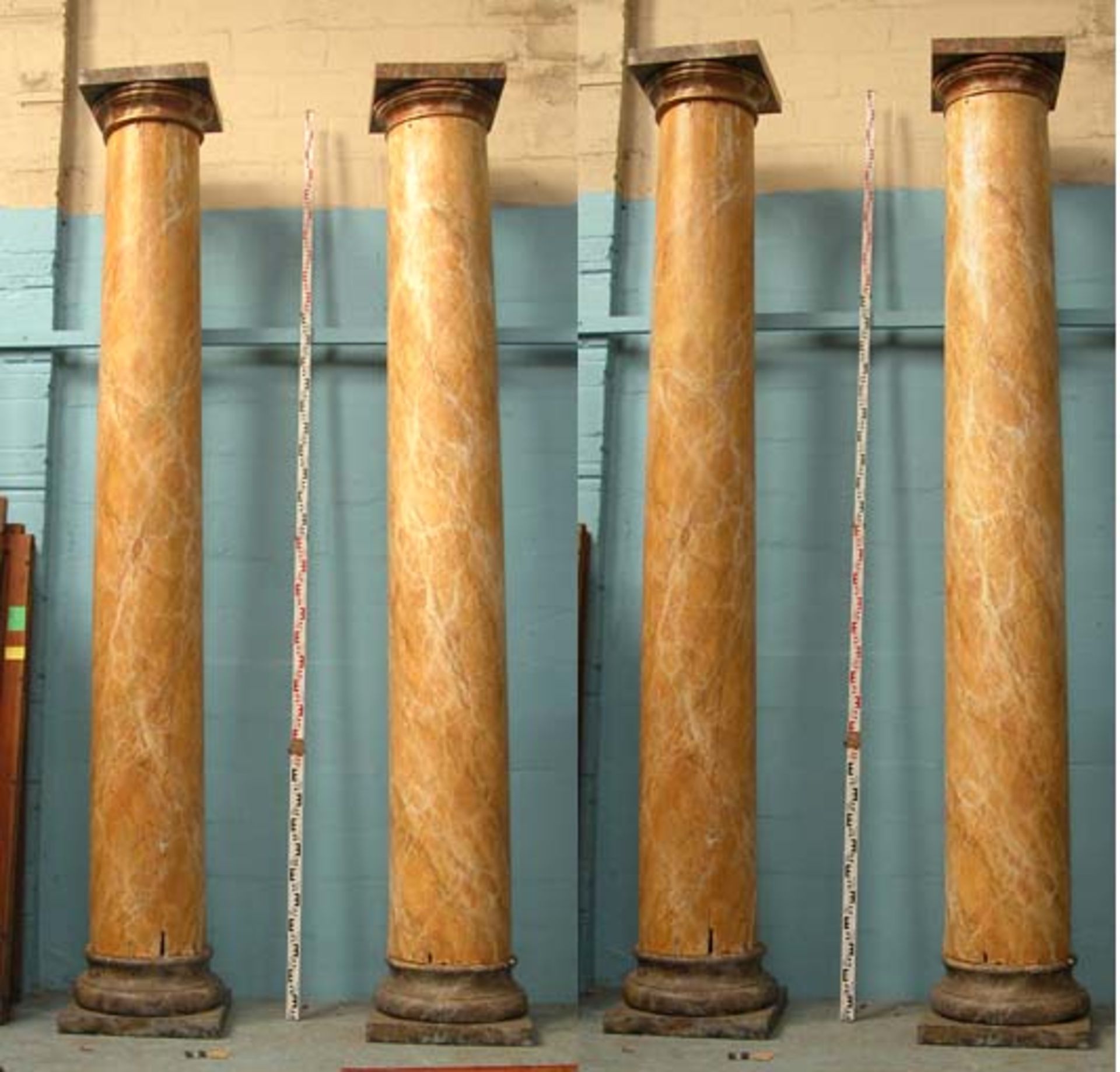 *SET OF FOUR LARGE PINE CLASSICAL STYLE COLUMNS WITH MARBLE EFFECT PAINTWORK, LATE 1900. EACH 3845MM