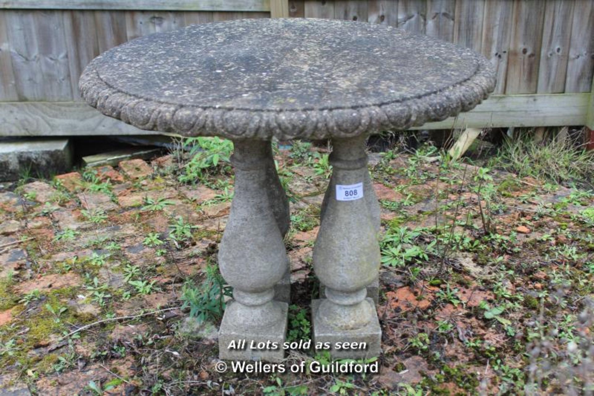 *COMPOSITION STONE CIRCULAR TABLE TOP ON FOUR BALLUSTRADE SECTION LEGS