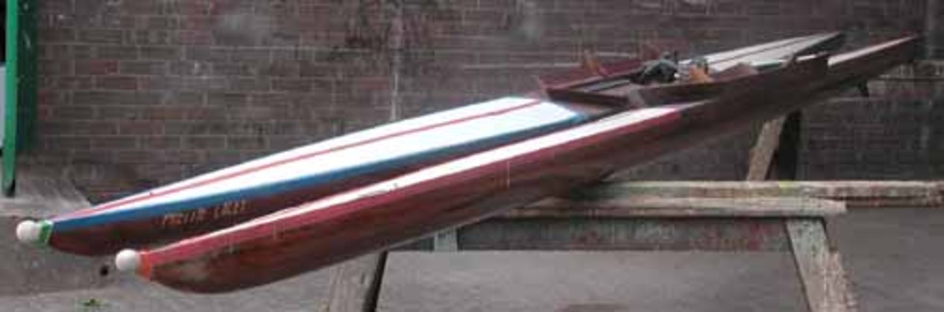 *PAIR OF WOODEN SCULLING BOATS