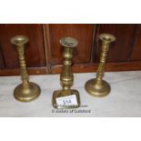 *PAIR OF BRASS CANDLESTICKS AND ONE OTHER
