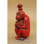 A Chinese Red Snuff Bottle Carved As A Monkey