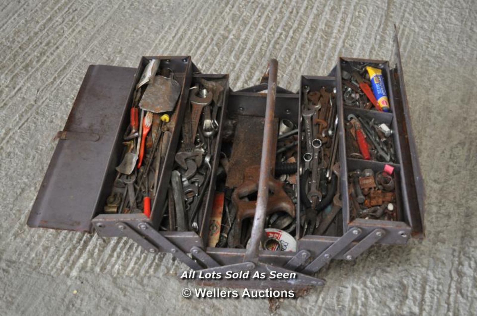 METAL FOLD OUT TOOLBOX FULL OF OLD TOOLS INCLUDING SPANNERS, NUTS AND BOLTS ETC