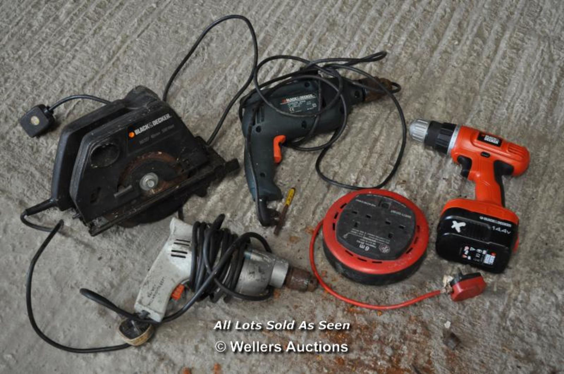 FOUR MAINLY BLACK AND DECKER POWER TOOLS AND EXTENSION LEAD