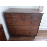 A Victorian chest of five drawers turned handles