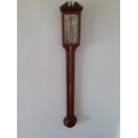 A modern reproduction stick barometer by Comitti Holborn having an oak and mahogany case.39"