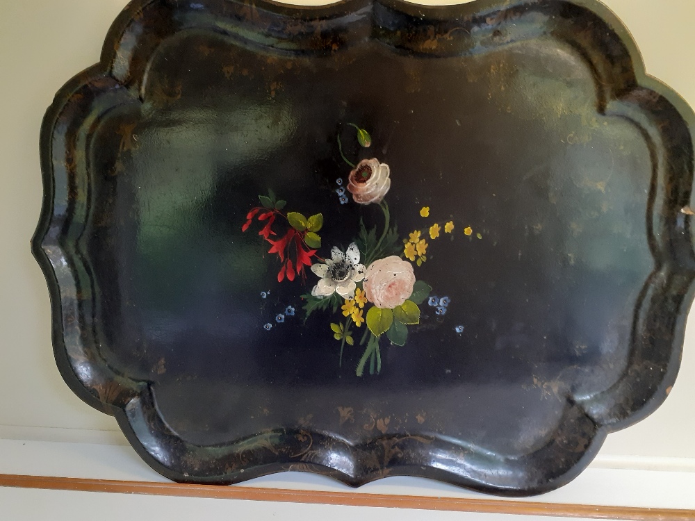 A large 19th century papier mache tray with painted flowers.