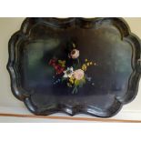 A large 19th century papier mache tray with painted flowers.