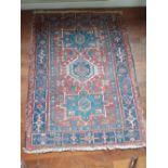 A Kazak rug in Blue and red geometric panels