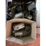 A box of pewter tankards various periods