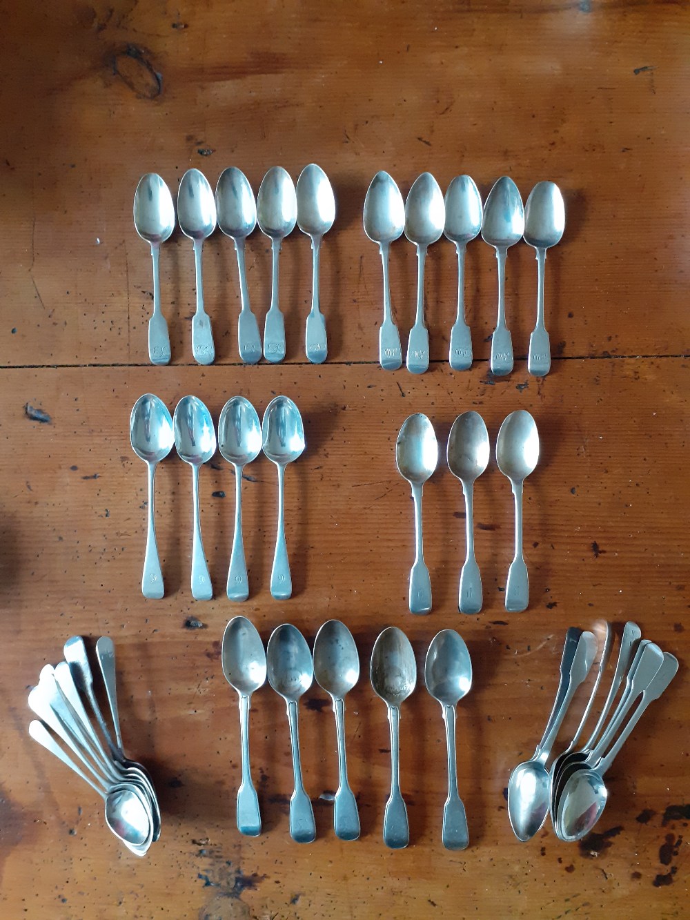 Five Georgian Silver teaspoons London 1827 together with a matching five, five, four ,three and a co