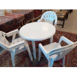 A modern white plastic garden table and six chairs