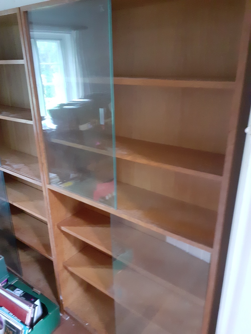 Four glass fronted bookcases