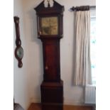 An 18th century/Early 19th Century eight day brass faced oak and mahogany long case clock by Robert