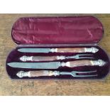 A 19th century cased set of four silver mounted and bone handled carving knives and forks
