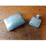 A small plain silver hip flask Birmingham 1903 2oz together with a silver engine turned cigarette ca
