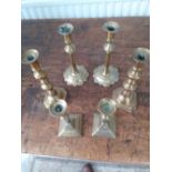 Two pairs of Georgian brass candlesticks and a pair of Victorian brass candlesticks