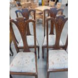 Four Edwardian dining chairs with inlaid splat backs