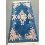 A modern Chinese blue floral rug 36" x76"