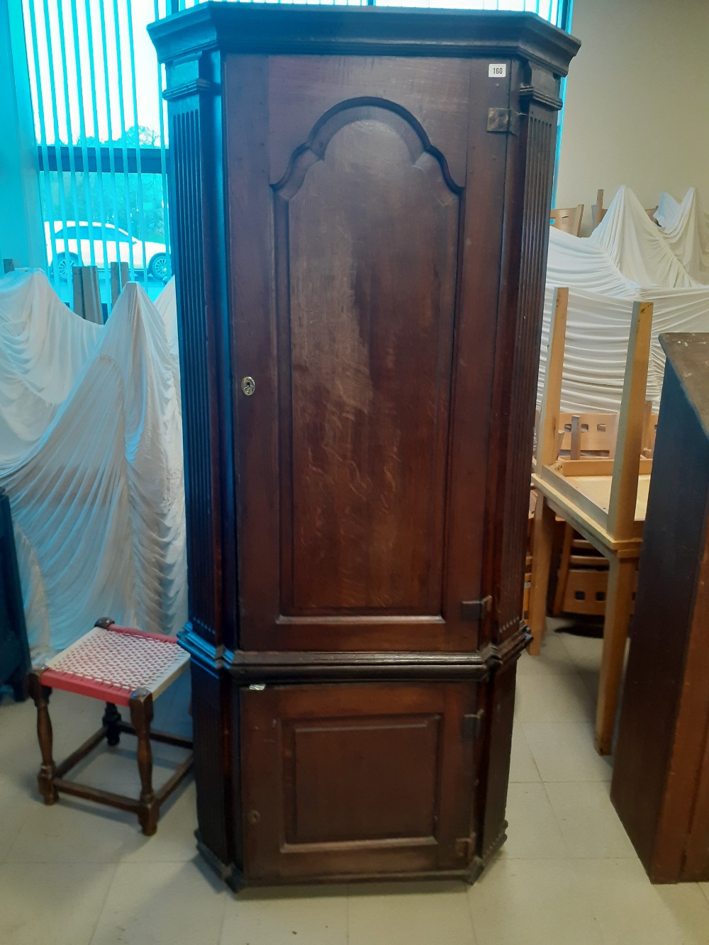 A late 18th century Oak double corner cupboard with canted reeded corners.32"x78"