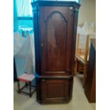 A late 18th century Oak double corner cupboard with canted reeded corners.32"x78"