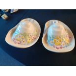 A pair of Beswick wall pockets in the shape of floral straw hats.