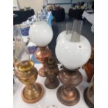 A collection of 5 copper and brass oil lamps