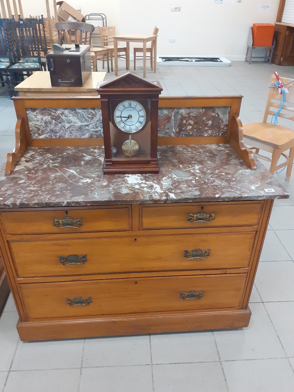 A victorian satinwood washstand with a marble top and back 42"x20"x31""