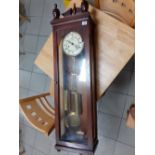 A mahogany cased wall clock 49"high