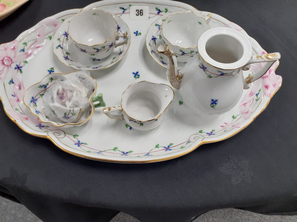 A Herand Hungary porcelain cabaret coffee set hand painted with flowers.