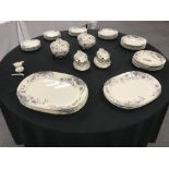 An Edwardian Staffordshire Belgrave pattern part dinner service with floral decoration.