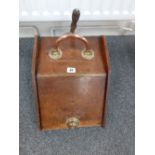 A Victorian oak coal box with copper and brass handles/shovel