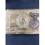 A WW1 brass chocolate tin 1914 together with a territorial medal.