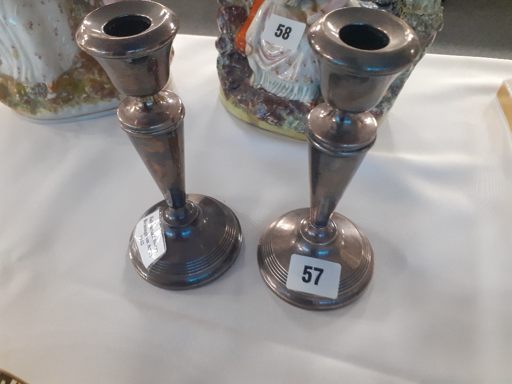 A pair of loaded silver candlesticks Birmingham 1932.7"high