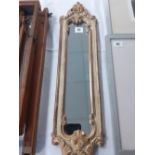 A painted and gilt plaster wall mirror 25"length