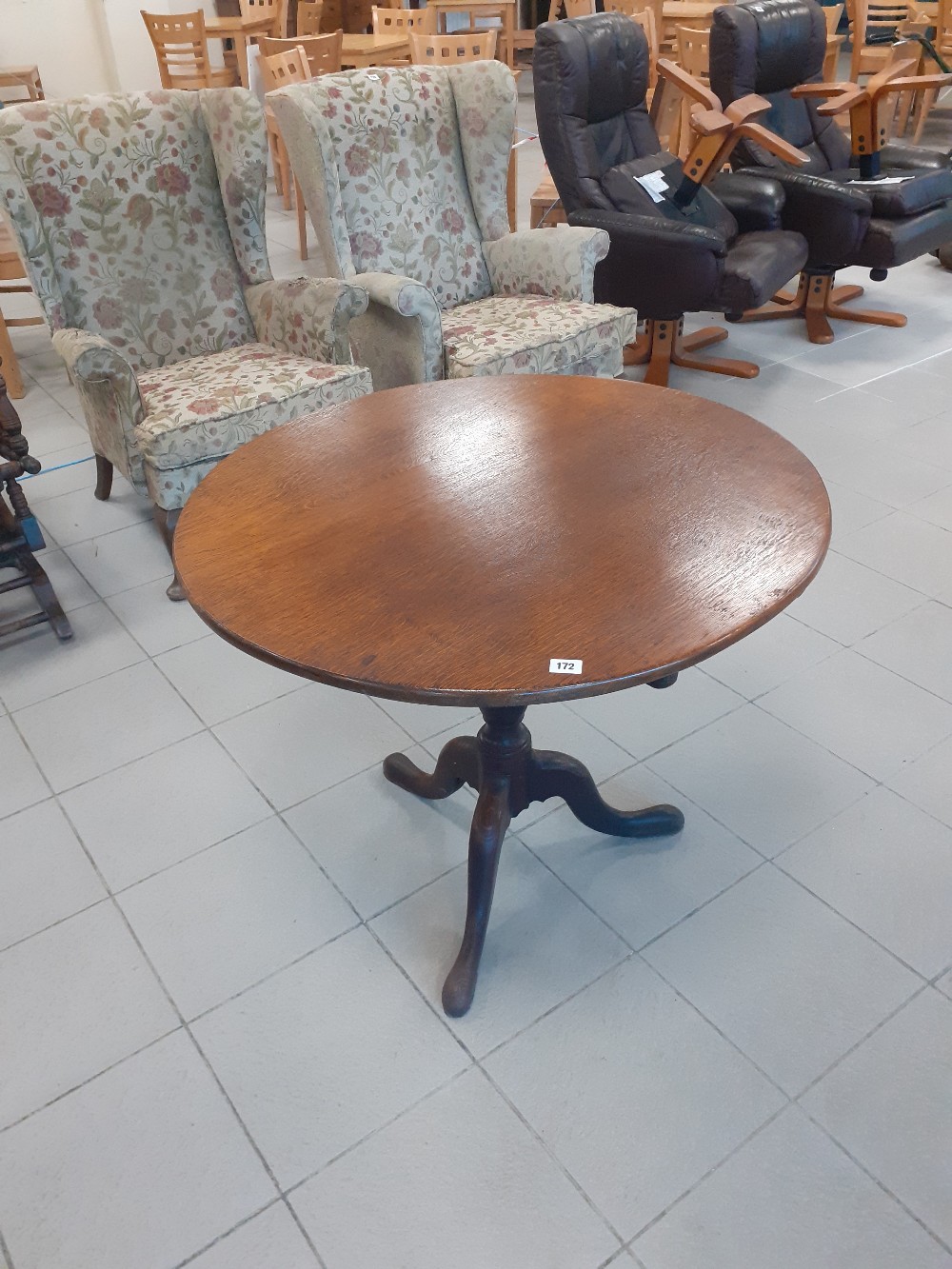 An early 19th century oak tripod table later top 33" dia