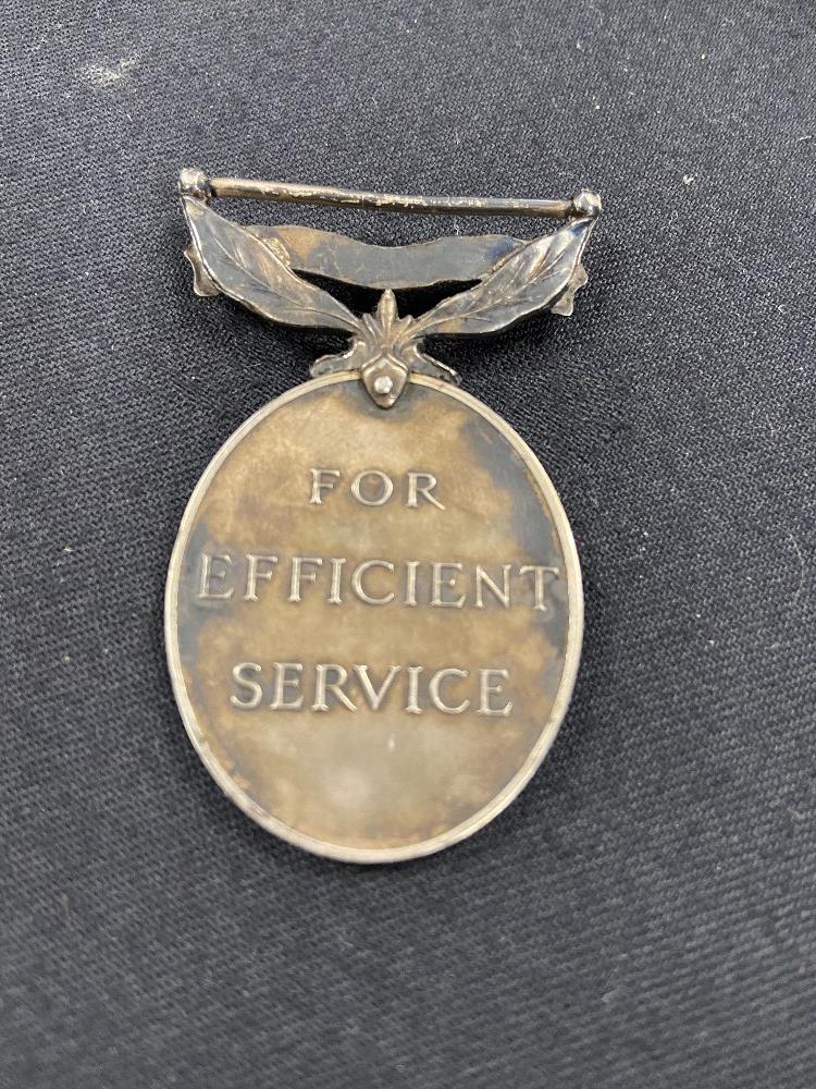 A WW1 brass chocolate tin 1914 together with a territorial medal. - Image 4 of 4