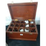 A wooden case containing 15 wine glasses.