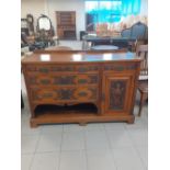 A Victorian Mahogany carved sideboard with four drawers and a cupboard.22"x59"x58"