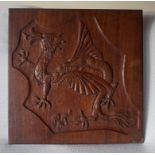 A Mahogany wall plaque with a carved dragon 19.5" square