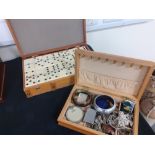 A qty of costume jewellery and a large boxed domino set.