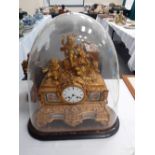 A 19th century gilt and Ormolu clock with classical figures. Under a glass dome 21" high