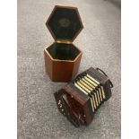 A Victorian Lachenal and co concertina in original wooden case. Excellent condition.